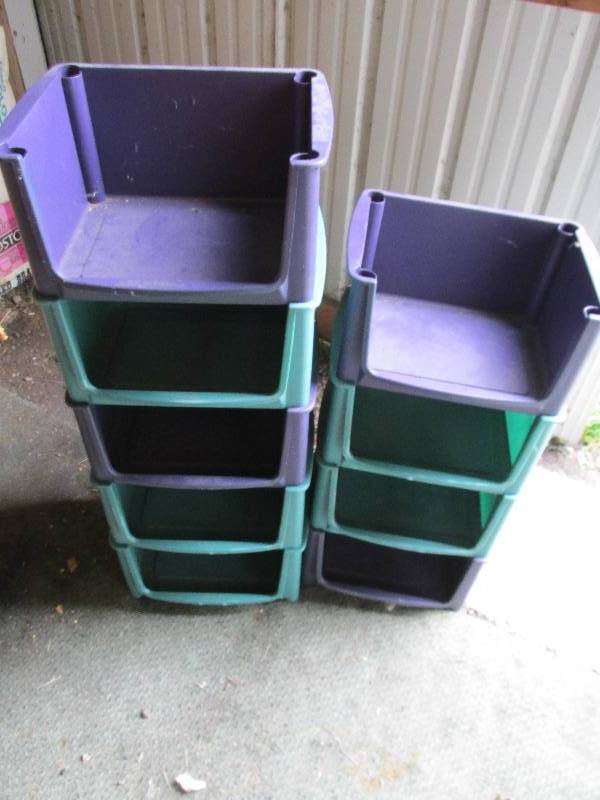 Stack of 9 stackable Sterilite stor...