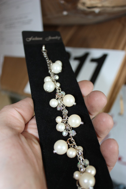 lot 211 image: Faux pearl bracelets