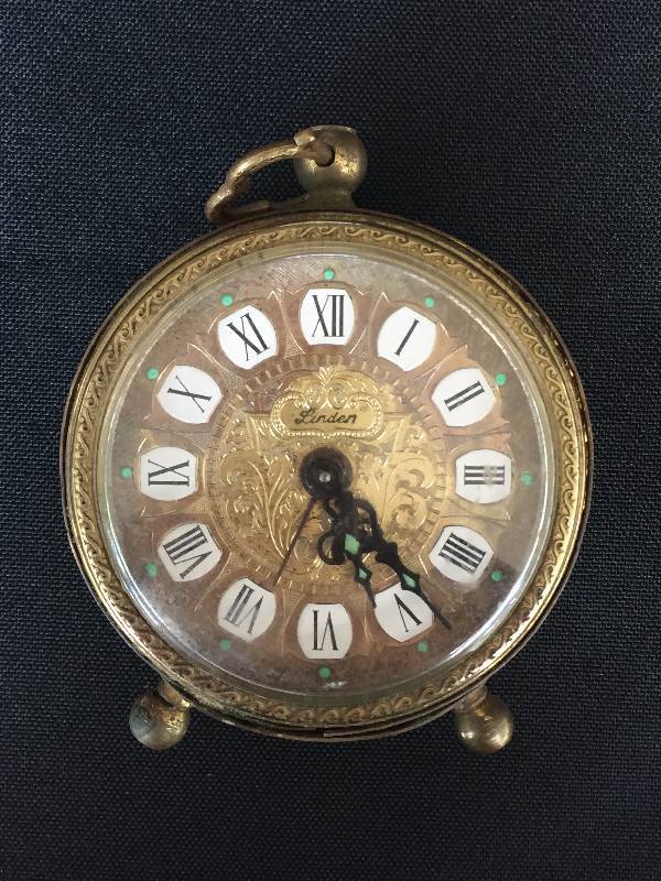 lot 5 image: Turn of the century barometer marked pnhb & a ornate small clock.
