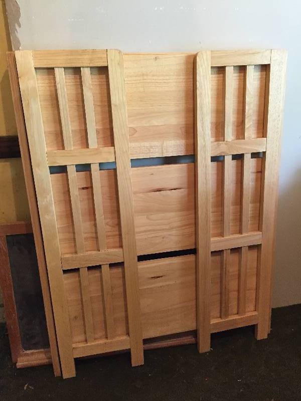 Blond maple wood folding shelf unit.