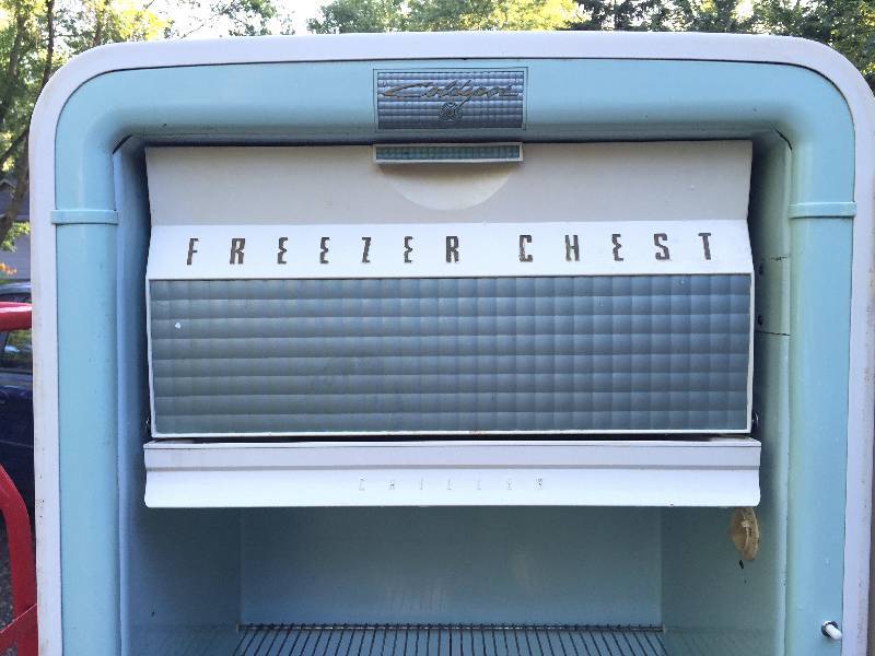Vintage refrigerator with Chrome handle and details. Can be easily made into a smoker.