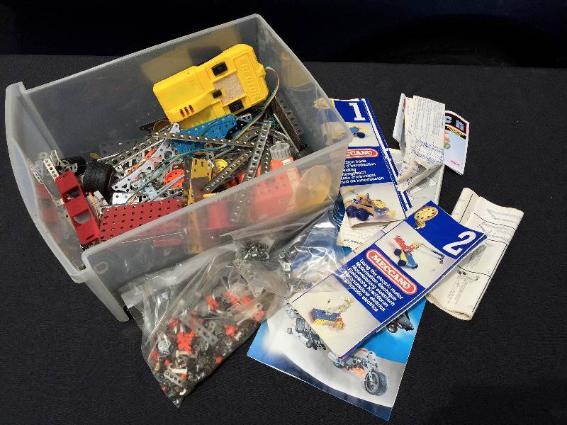 lot 12 image: Very large box of Vintage Erector sets and manuals.