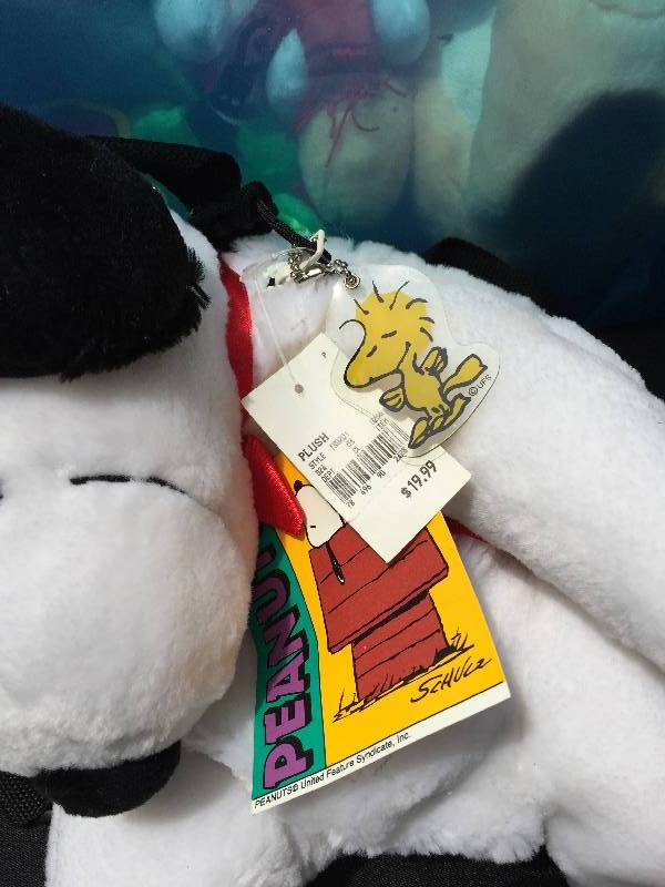 lot 18 image: Large bin of collectible stuffed toys including snoopy
