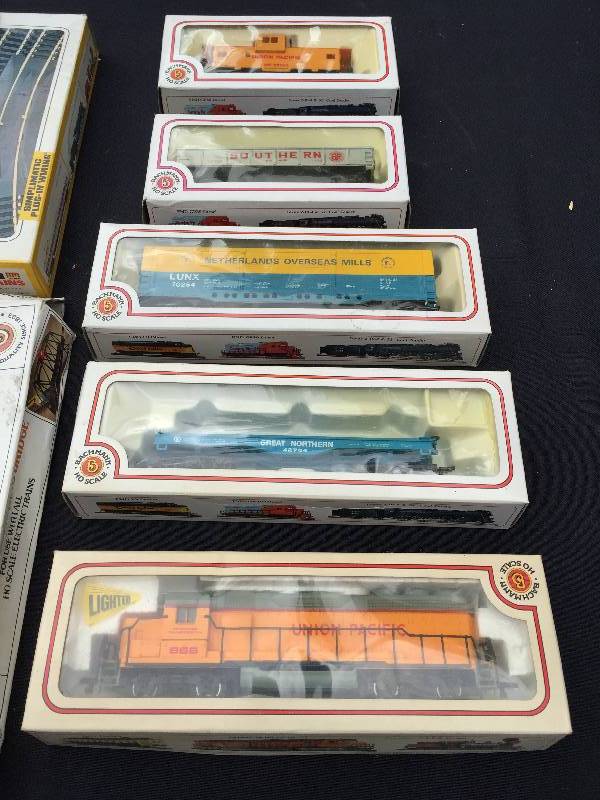 lot 1 image: Large lot of 8 boxed collectible trains with tracks and a bridge.. ooooh ooooooo