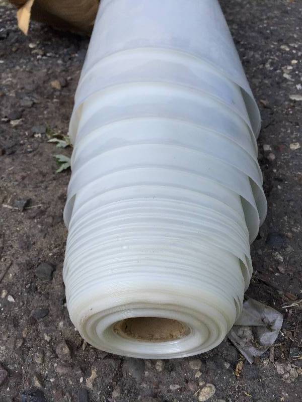 large roll of unused very very thick polly 12 Foot long X really long box