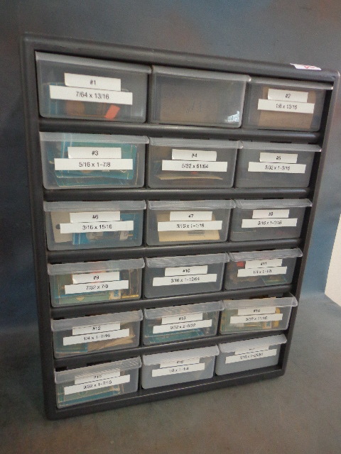 lot 22 image: 18 drawer bin organizer filled with shear pins