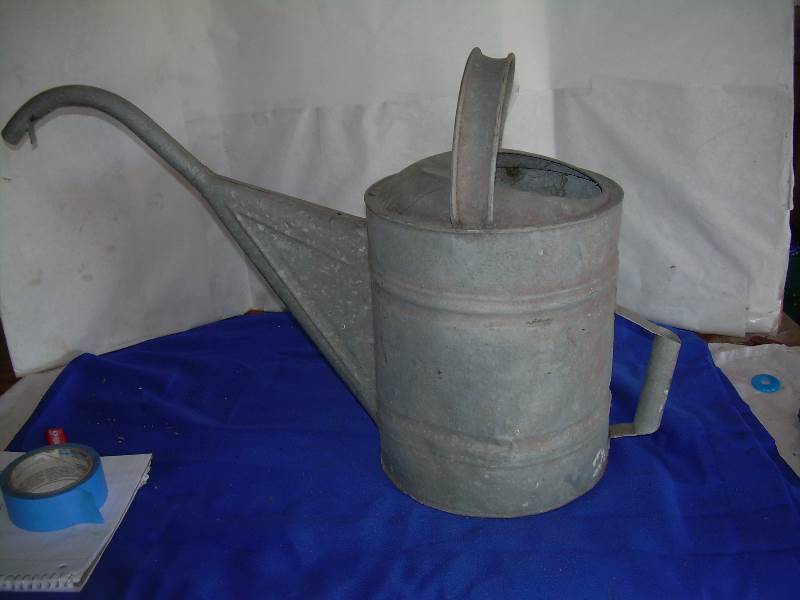 antique metal watering can