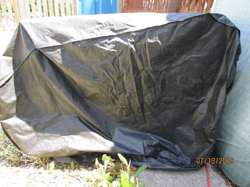 Large black grill cover with velcro...