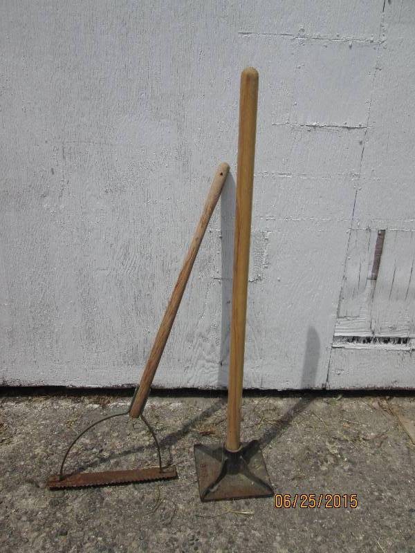 Pair of landscaping tools. Tamper a...