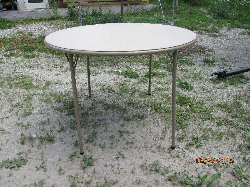 40 round folding table with tan vi...