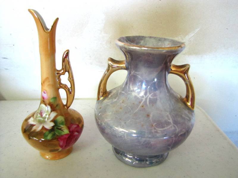 two small vases one is lefton the other maybe
