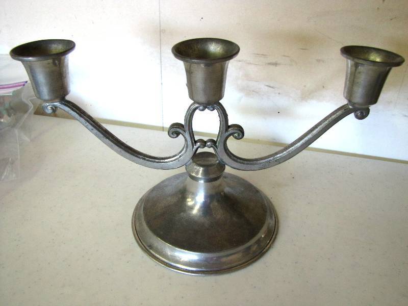 solid pewter candlestick holder holds three candles