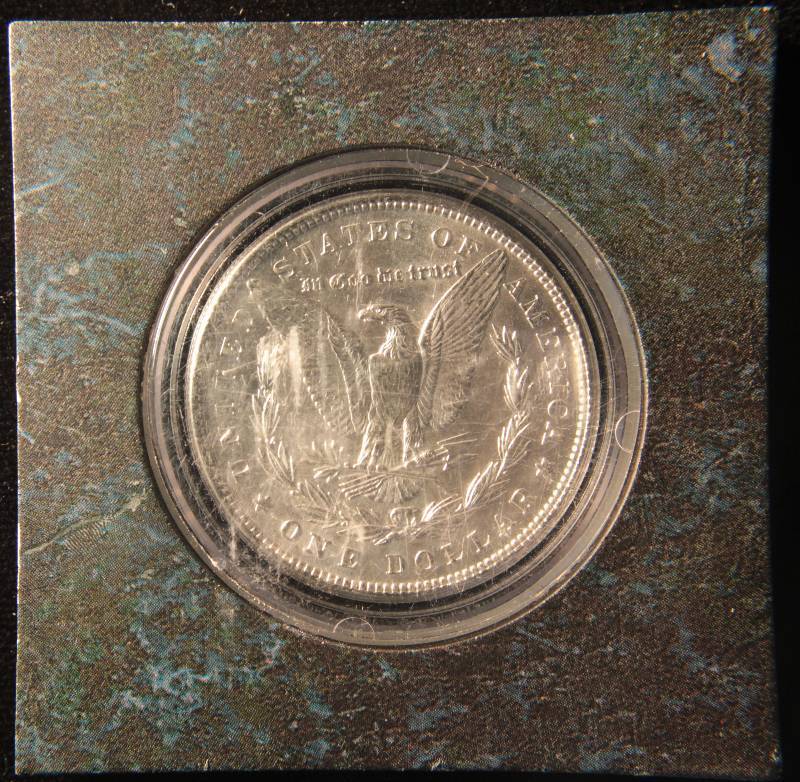 1884 MORGAN SILVER DOLLAR AU