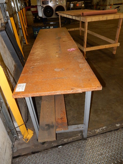 Hardboard topped work table.. 24inw x 8ft long x 35in h.. Very solid