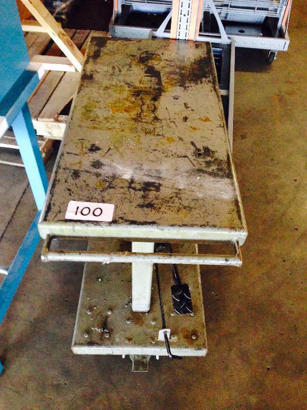 Foot operated lift table