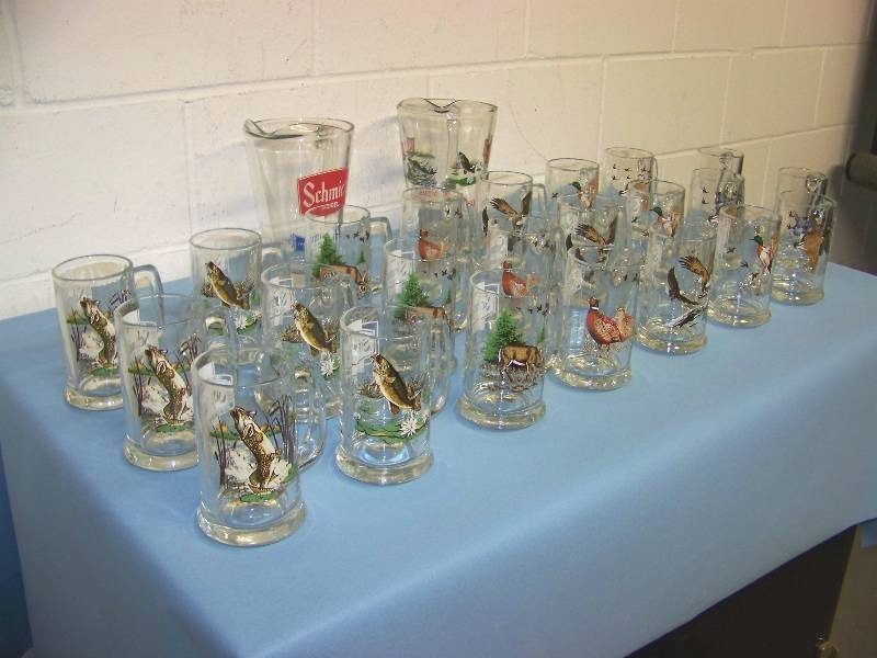 lot 6 image: (24) Schmidt Beer, Collectible  Vintage, Mugs and (2) Collectible  Vintage, Schmidt Beer Pitchers