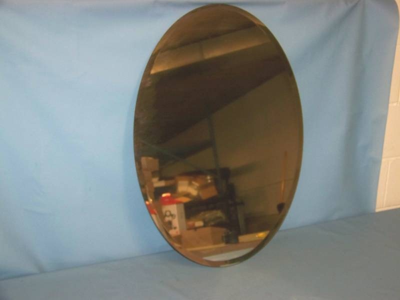lot 42 image: Oval-Shaped Mirror with Beveled Edge