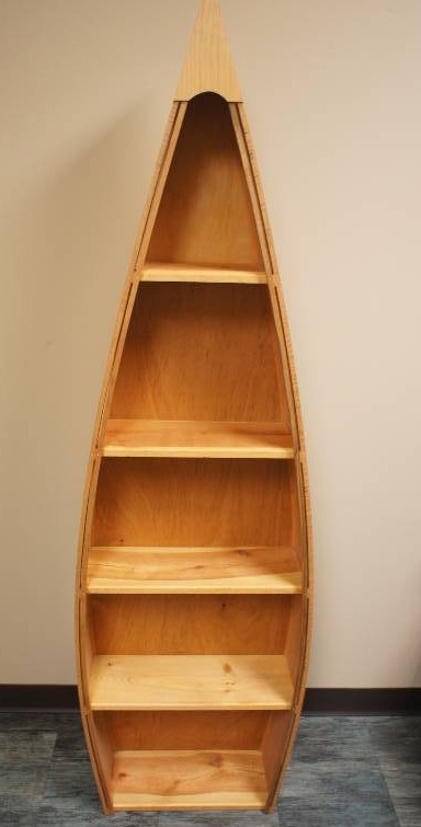 lot 83 image: Six Foot Tall Canoe Shaped Display Bookcase