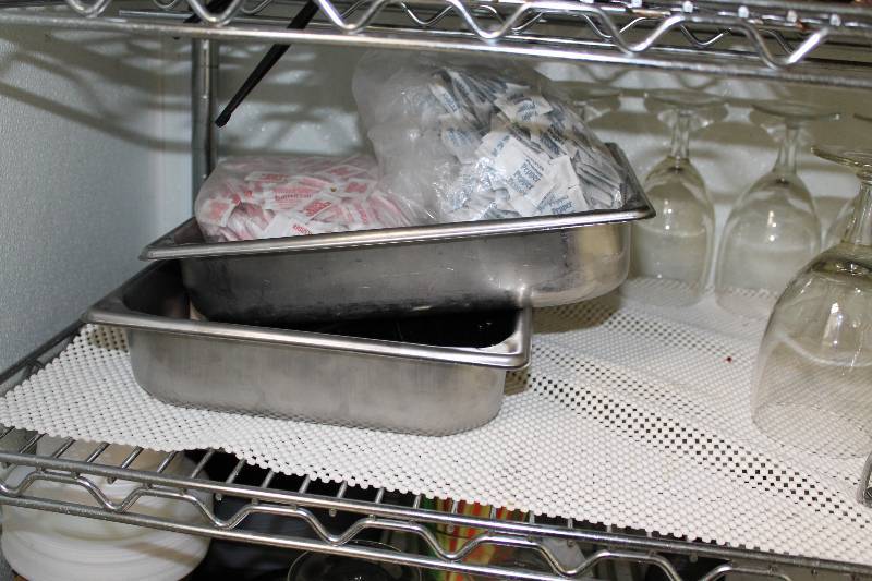 lot 555 image: Shelf Lot Including Wine Glasses Stainless Steel Metal Trays Glass Oil Burner And More.