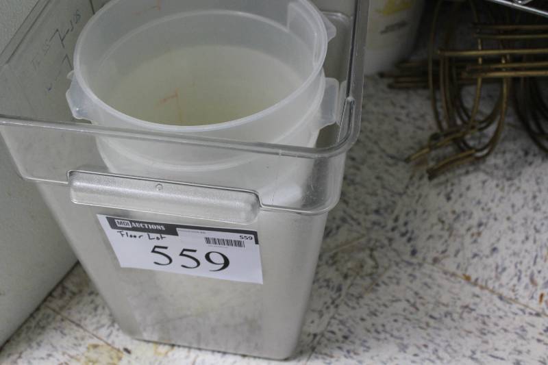 lot 559 image: Floor Lot Including Metal Display Shelves Plastic Buckets, NSF Approved Decorative Stand wGlass Insert And More.