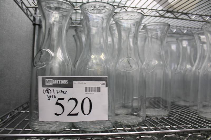 lot 520 image: Lot of (14) Glass Carafes 1 Liter Includes Plastic Container.