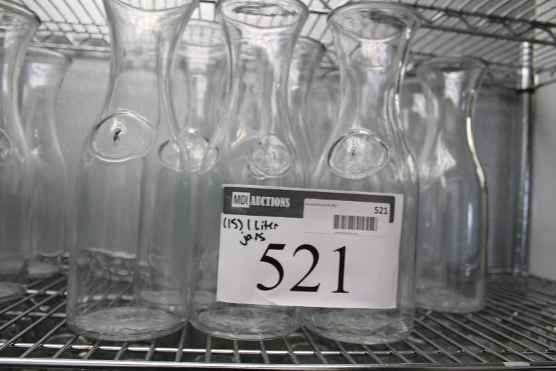lot 521 image: Lot of (15) Glass Carafes 1 Liter Includes Plastic Container.