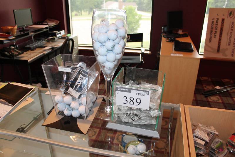 lot 389 image: Container Lot of (3) Including Golf Tees Golf Balls pinnacle Golf Balls Divet Fixer And More.
