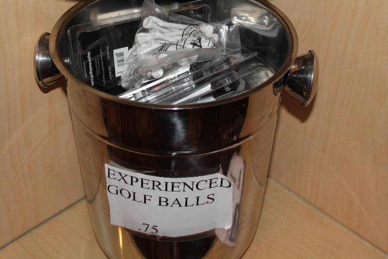 lot 391 image: Shelf Lot Including Metal Pail Golf Tees And More.