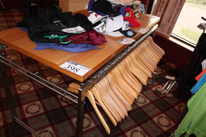 lot 398 image: Metal Display Table wWooden Top Includes Wooden Coat Hangers 30 x 63 x 38.