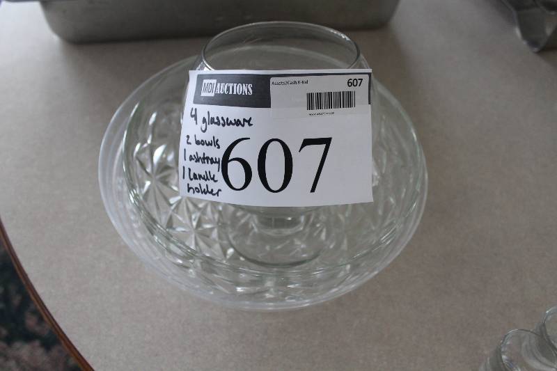 lot 607 image: Lot of (4) Including Glass Serving Bowls (2) Glass Ashtray Glass Candle Holder.