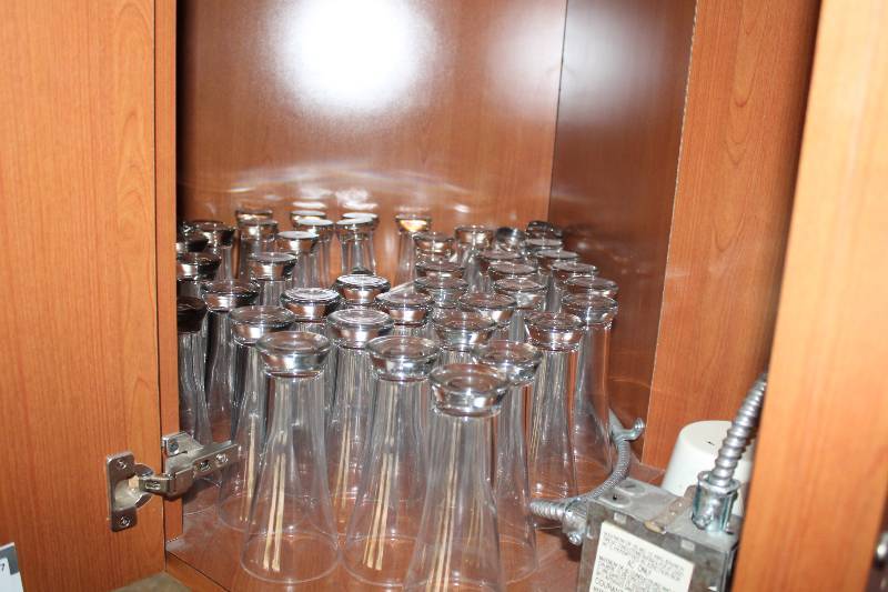 lot 487 image: Shelf Lot Including Drinking Glasses 1.5 oz Shot Glasses Beer Glasses And More.