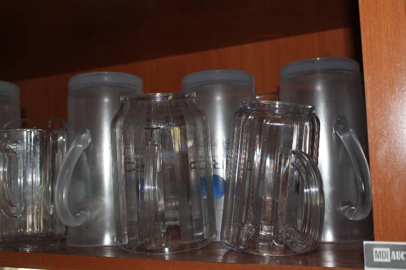 lot 490 image: Shelf Lot of Pitchers Including Plastic Pitchers Ciroc Vodka Pitchers.