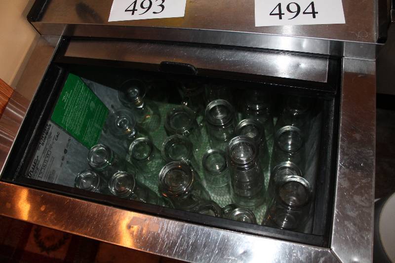 lot 493 image: Contents of Cooler Including Beer Glasses Stella Artois Glasses Glass Mugs And More.
