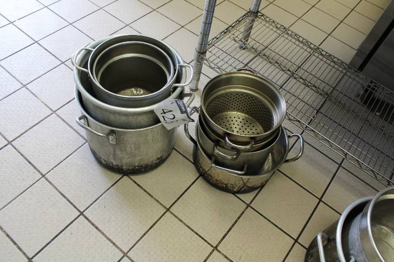 lot 423 image: Lot of (8) Metal Stock Pots wHandles Miscellaneous Shapes & Sizes Includes Metal Strainer Pot.