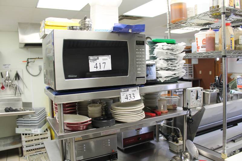 lot 433 image: Contents of Shelf Including Ceramic Dinner Plates Plastic Serving Baskets Baking Dishes And More Does Not Include Microwave.