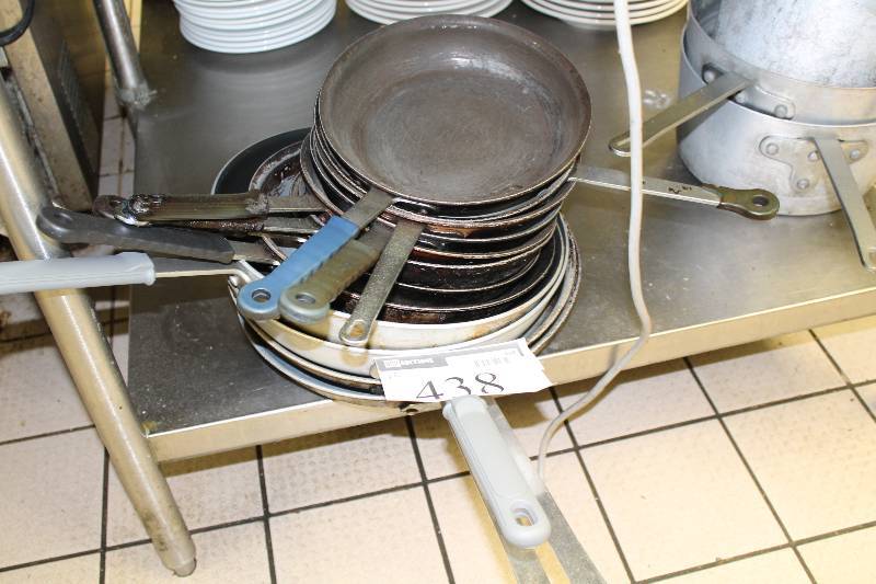 lot 438 image: Lot of (12) Metal Frying Pans wRubber Grip Handles Not All Include Rubber Grip.