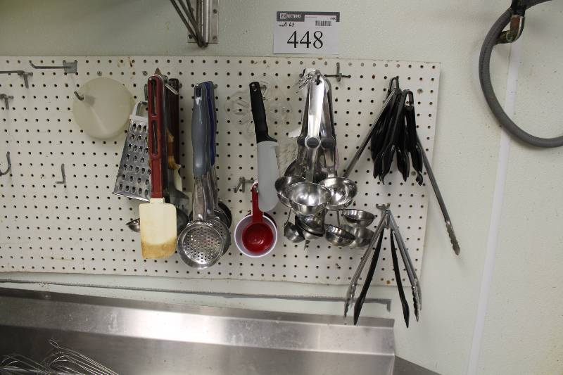 lot 448 image: Wall Lot Including Cheese Grater Strainer Scoops Rubber Spatula Stainless Steel Soup Ladles And More.