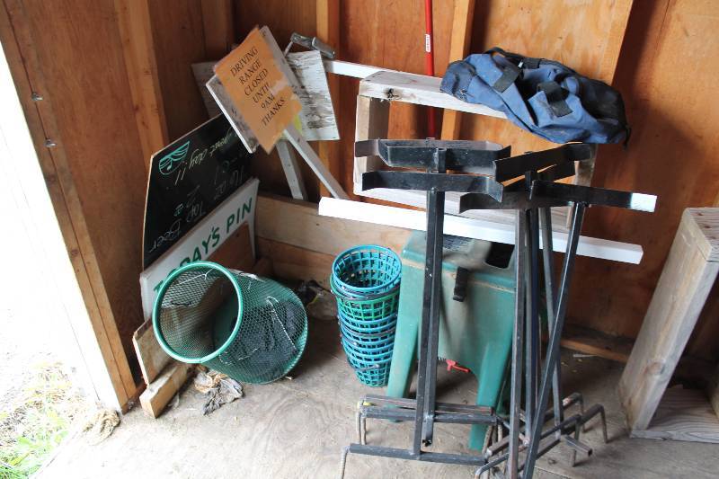 lot 676 image: Corner Lot Including Golf Bag Holder Stands Plastic Bins Plastic Golf Ball Buckets wHandles And More.