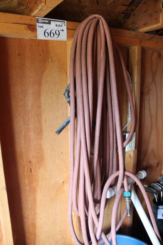 lot 669 image: Rubber Hose wMetal Nozzle Attachment.
