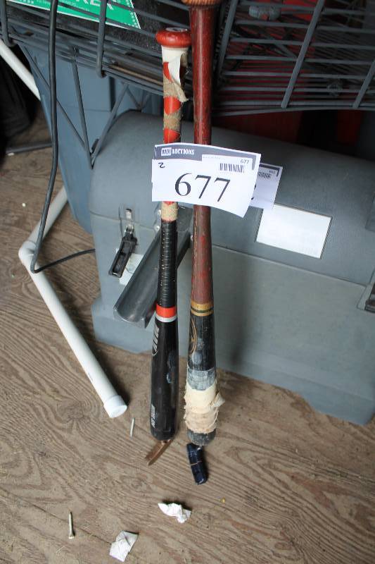 lot 677 image: Lot of (2) Practice Putters Attached To Baseball Bats.