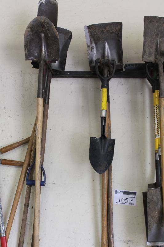 lot 105 image: Rack Lot Including Metal Shovels Flat End Shovels Small Shovel And More.