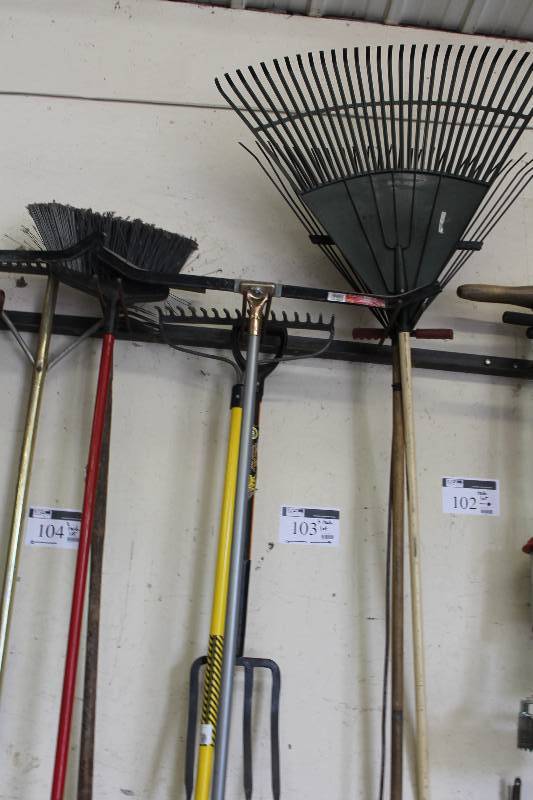 lot 103 image: Lot of (3) Racks Including Rakes Brooms Metal Rake Pitch Fork And More.