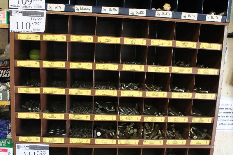 lot 110 image: Organizational Unit wMultiple Cubbies For Hardware Storage Includes Contents.