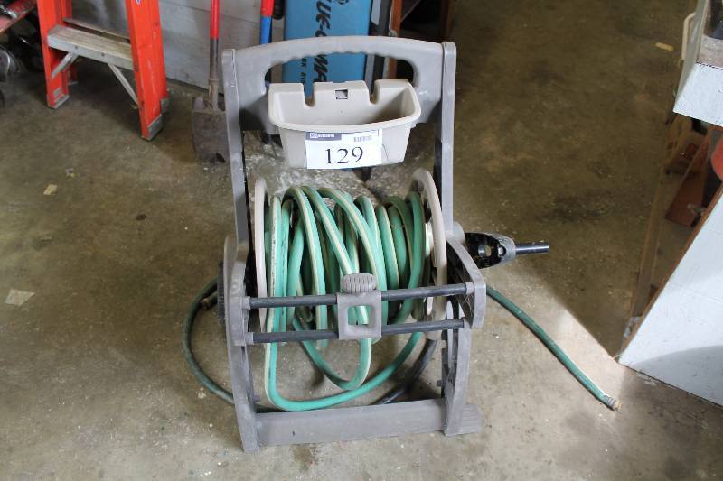 lot 129 image: Rubber Hose wPlastic Hose Reel Stand.
