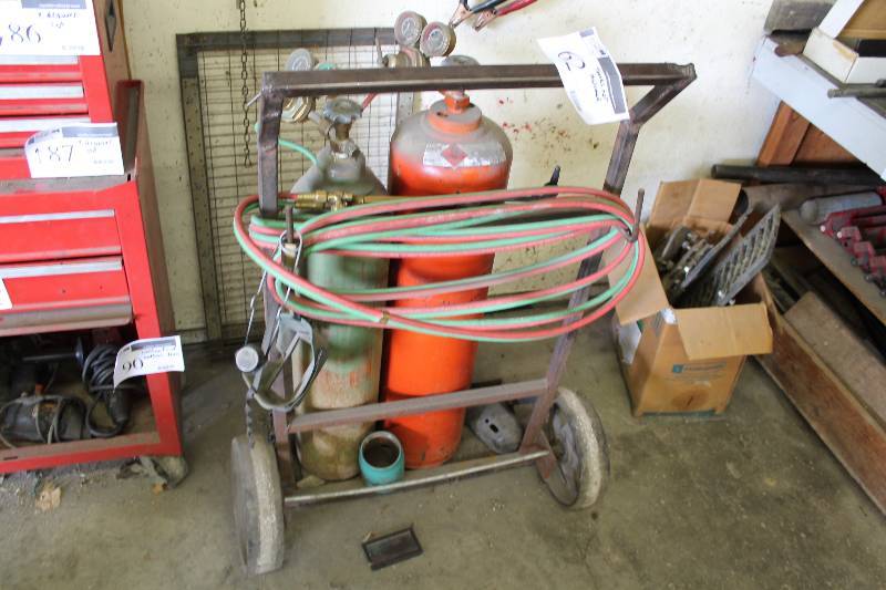 lot 62 image: Propane Cylinder Rolling Cart wMetal Frame & Wheels Does Not Include Cylinders Or Tanks.