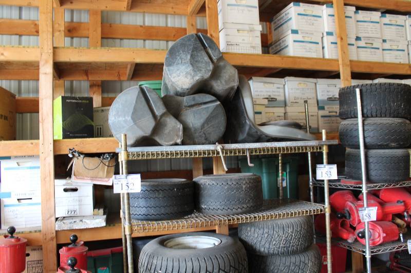 lot 152 image: Contents of Rack Including Tires wRims, Miscellaneous Sizes And More.