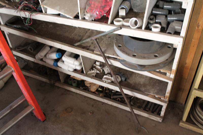 lot 193 image: Contents of Shelf Including PVC Pipe Metal Hardware Fittings & Adapters And More.