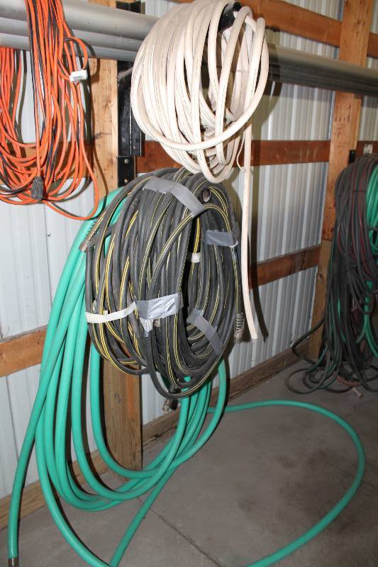 lot 197 image: Lot of (4) Rolls of Rubber Hose GreenBlackOrangeWhite.