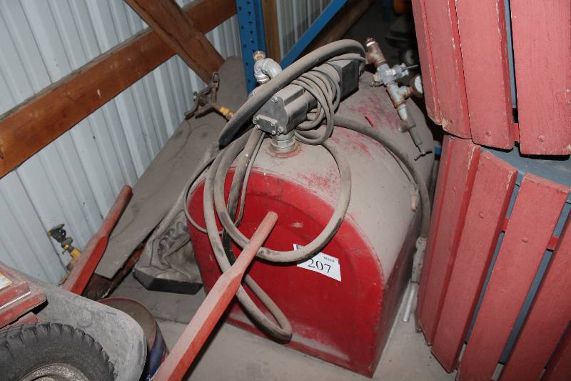 lot 207 image: Gas Can  Drum wFuel Transfer Pump Model FP12 12V12A4HP 24 x 24 x 39.