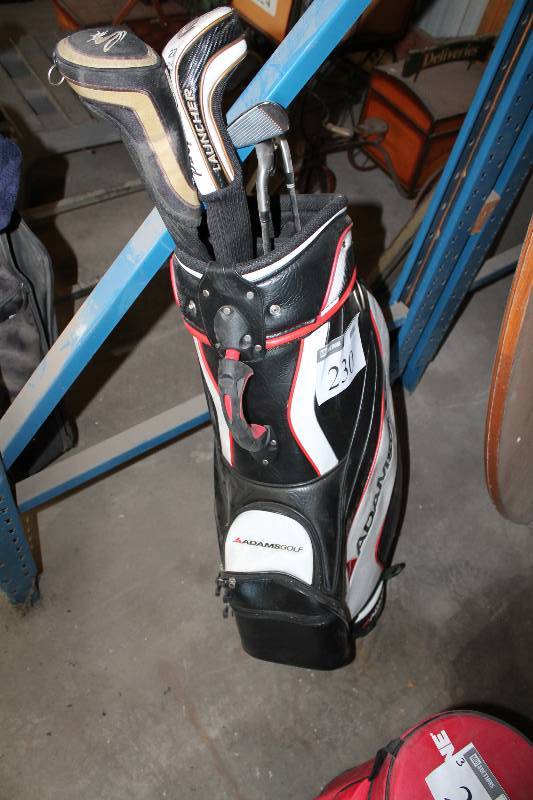 lot 230 image: Adams Golf Bag wDrivers, Club Guards & Irons, app. 5 ct.